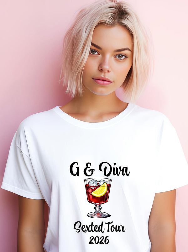 May include: White t-shirt featuring a cocktail illustration with ice and lemon. The text reads "G & Diva Sexted Tour 2026". The model is wearing the shirt. The background is a light pink.