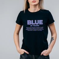 May include: Black t-shirt featuring the word "BLUE" in purple, with "25 YEARS" beneath. A list of UK cities, including Oxford, Birmingham, and Brighton, is printed below. The shirt has a crew neck.